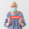 Front View Of Elder Woman With Medical Mask Holding Message Psd