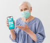 Front View Of Elder Woman With Medical Mask Holding Smartphone Psd