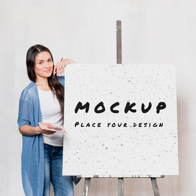 Front View Of Female Artist With Mock-Up Easel And Canvas Psd