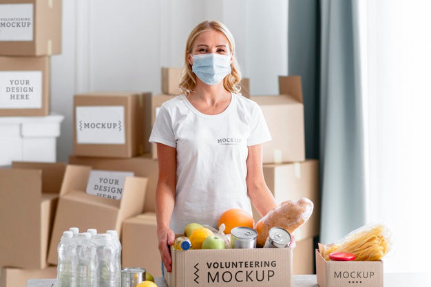 Front View Of Female Volunteer With Medical Mask Preparing Food Donations Psd