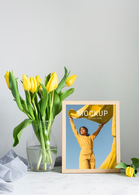 Front View Of Frame With Bouquet Of Tulips In Vase Psd