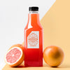 Front View Of Grapefruit Juice Bottle With Cap Psd