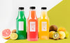 Front View Of Juice Bottles With Grapefruit And Kiwi Psd