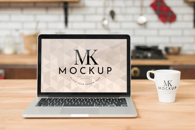 Front View Of Laptop In The Kitchen With Mug Of Coffee Psd