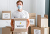 Front View Of Male Volunteer With Medical Mask Holding Food Donation Box Psd