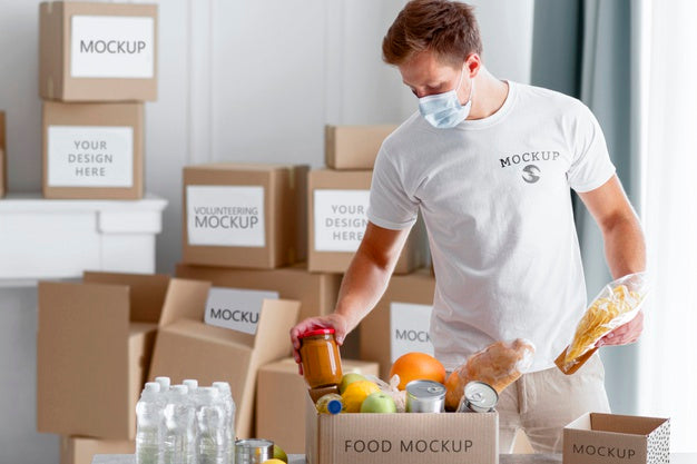 Front View Of Male Volunteer With Medical Mask Preparing Food Donation Box Psd