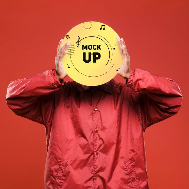 Front View Of Man Holding Vinyl Disk Over His Face For Music Store Mock-Up Psd