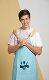 Front View Of Man In Apron Holding Wooden Spoons Psd
