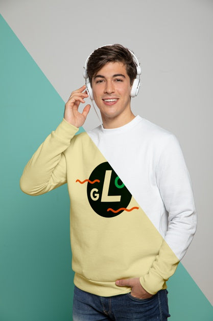 Front View Of Man Listening To Music On Headphones Psd