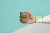 Front View Of Mug Held By Hand Psd