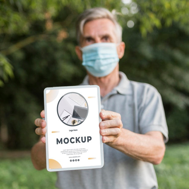 Front View Of Old Man Holding A Tablet Mock-Up Psd