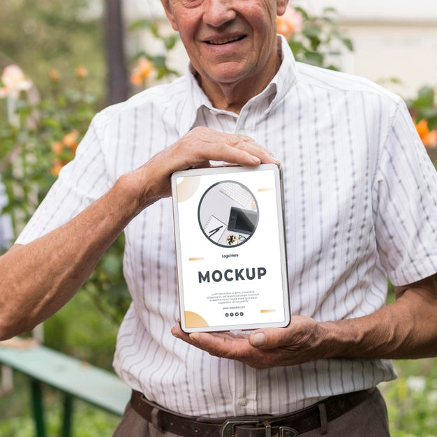 Front View Of Old Man Holding A Tablet Mock-Up Psd