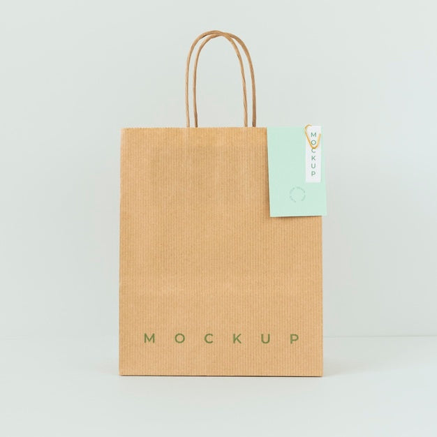 Front View Of Paper Shopping Bag Mock-Up With Paper Tag Psd
