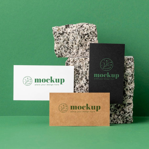 Front View Of Paper Stationery With Stones Psd