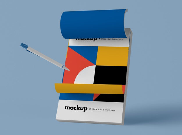 Front View Of Pen And Notepad With Geometric Shapes Psd