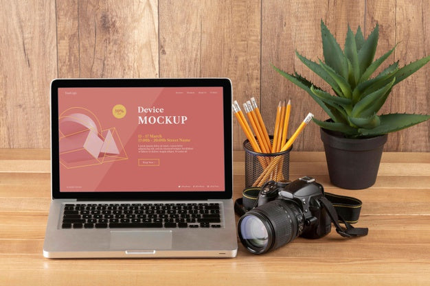 Front View Of Photographer Wooden Workspace With Laptop Psd