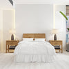 Front View Of Room With A Bed And Modern Wooden Night Tables Mockup Psd