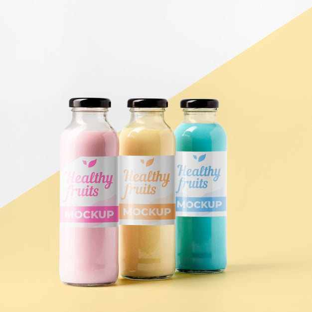 Front View Of Selection Of Clear Juice Bottles With Cap Psd