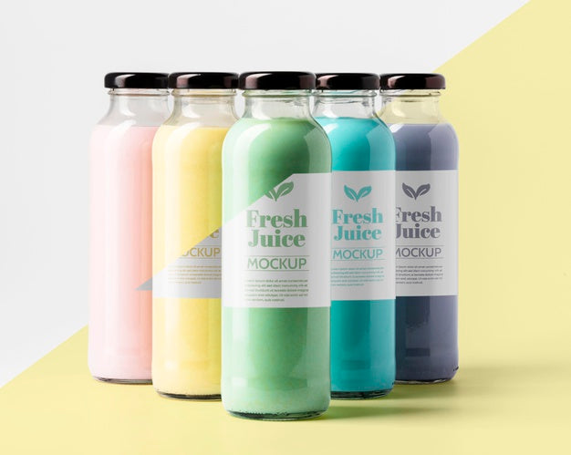 Front View Of Selection Of Transparent Juice Bottles Psd