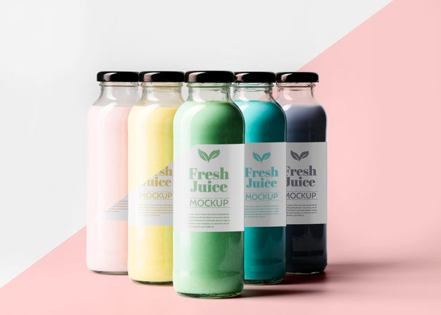 Front View Of Selection Of Transparent Juice Bottles With Cap Psd