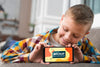 Front View Of Smiley Kid On Couch Holding Smartphone Psd