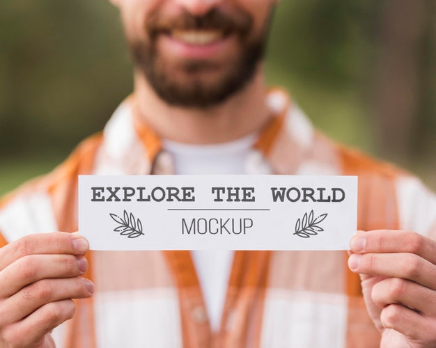 Front View Of Smiley Man Holding A Piece Of Paper While Camping Psd