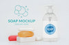 Front View Of Soap Bars And Bottle Of Liquid Soap Psd