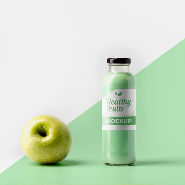 Front View Of Transparent Juice Bottle With Cap And Apple Psd