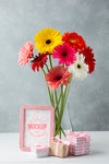 Front View Of Vase With Daisies With Frame And Gifts Psd