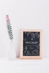 Front View Of Vase With Plant And Frame Mock-Up Psd