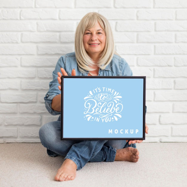 Front View Of Woman Holding A Frame Mock-Up Psd