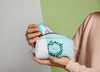 Front View Of Woman Holding Make-Up Pouch Psd