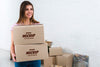 Front View Of Woman Holding Moving Boxes Mock-Up Psd