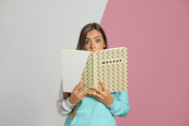 Front View Of Woman Holding Up Book Psd