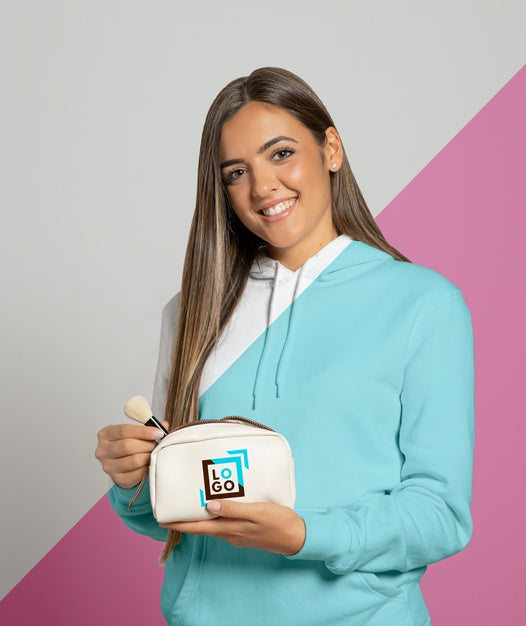 Front View Of Woman In Hoodie Holding Make-Up Pouch Psd