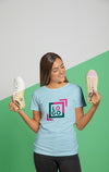 Front View Of Woman In T-Shirt Holding Sneakers Psd