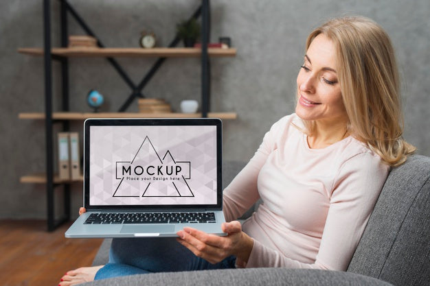 Front View Of Woman On Sofa Holding Laptop Psd