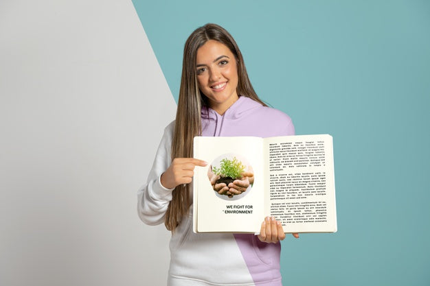 Front View Of Woman Pointing At Book She'S Holding Psd