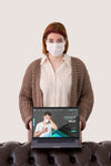Front View Of Woman With Masks Holding Laptop Psd