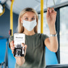 Front View Of Woman With Medical Mask In The Bus Holding Up Smartphone Psd
