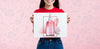 Front View Woman Holding A Mock-Up Ad For Cosmetics Psd