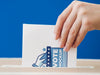 Front View Woman Putting Ballot Mock-Up In Box Psd