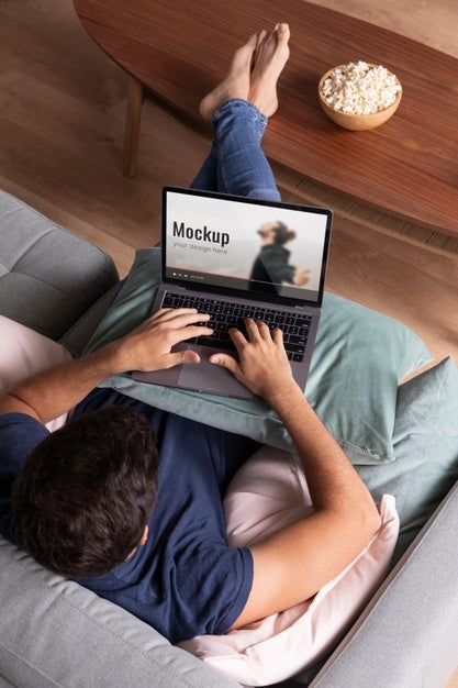 Full Shot Man Watching Movie On Laptop Psd