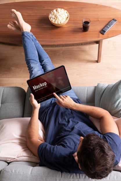 Full Shot Man Watching Movie On Tablet Psd