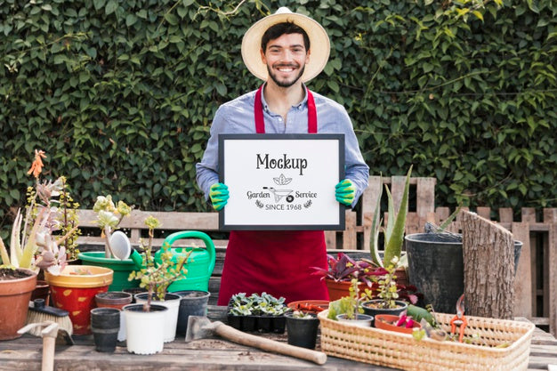 Gardener Holding Mock-Up Sign Psd