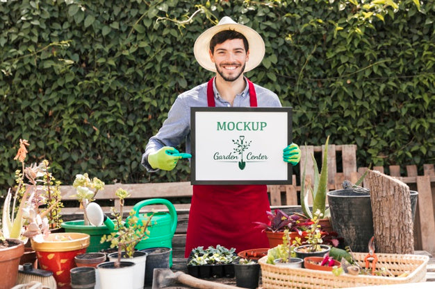 Gardener Holding Mock-Up Sign Psd