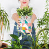 Gardening Concept With Woman Holding Plant Psd