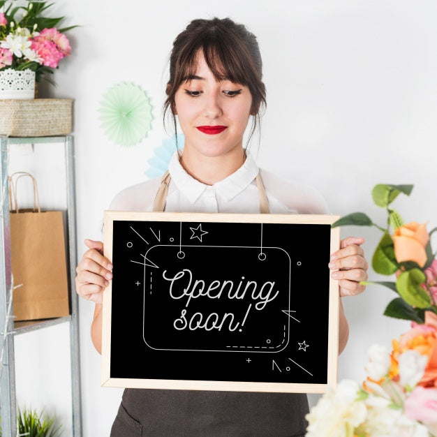 Gardening Concept With Woman Holding Slate Mockup Psd