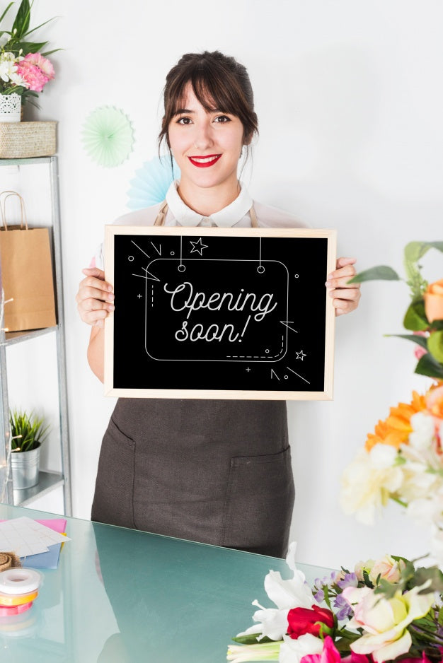 Gardening Concept With Woman Holding Slate Mockup Psd