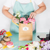 Gardening Concept With Woman Preparing Bag With Flowers Psd